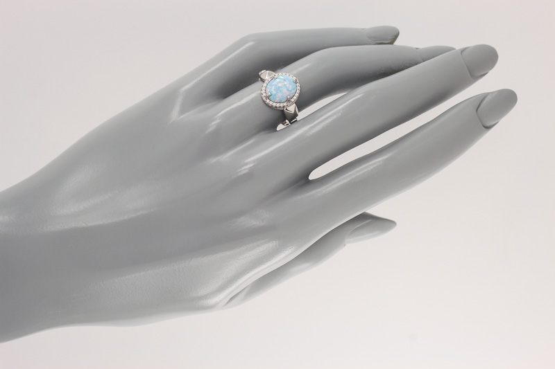 Изображение Серебряное кольцо с синт. опалом и цирконами 16,5 мм