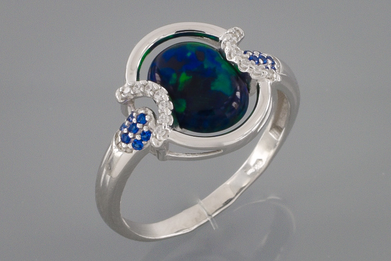 Изображение Серебряное кольцо с цирконами и синт. сапфирами 17 мм