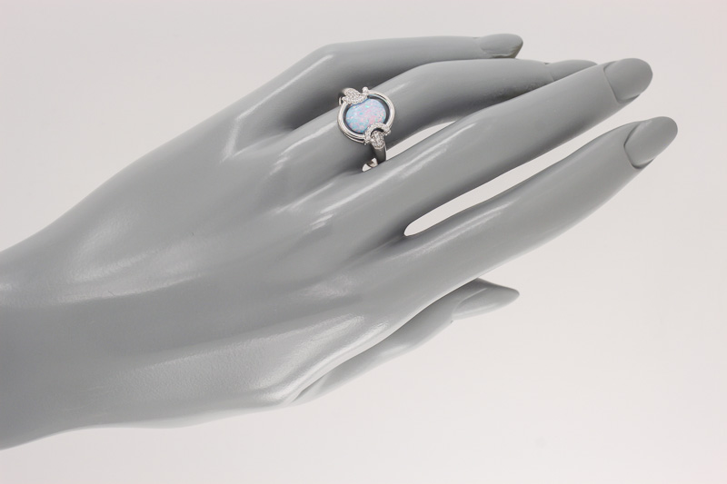 Изображение Серебряное кольцо с цирконами и синт. опалом