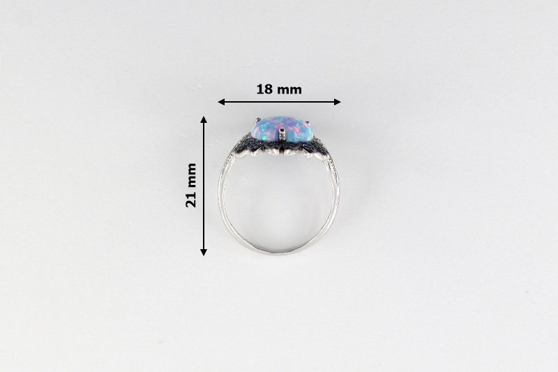 Изображение Серебряное кольцо с синт. опалом и цирконами 16 мм